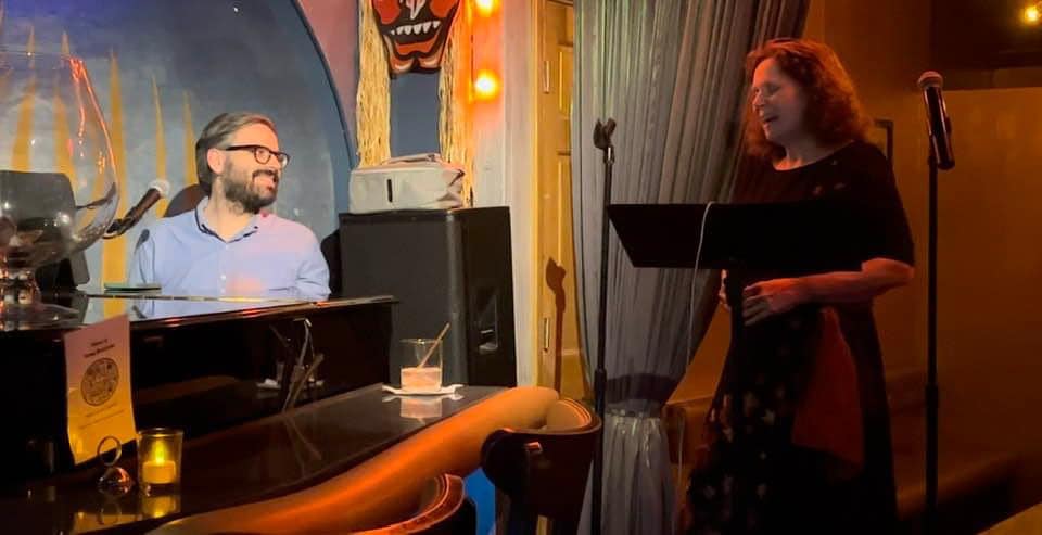 May be an image of 2 people, piano, clarinet and text